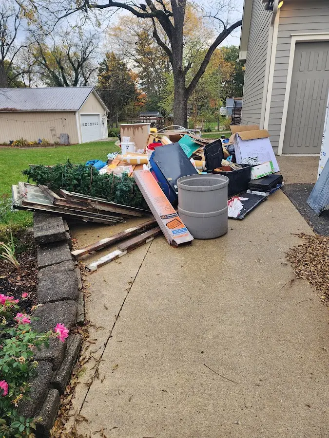 Dumpster being loaded with debris for 30 Yard Dumpster Rental in Martha Lake